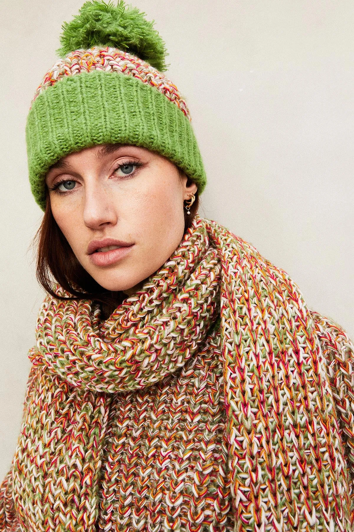 Lolly Twist Beanie Bobble Knitted Hat In Olive Green